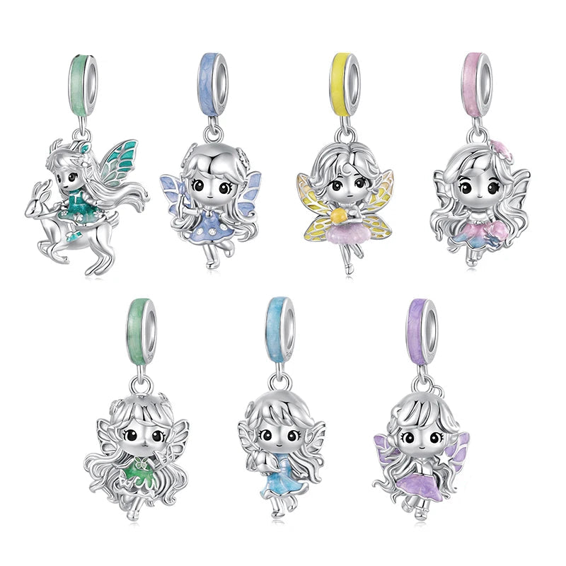 Set of silver fairy charms with colorful accents on a white background, featuring the brand 'mirrorquenn'.