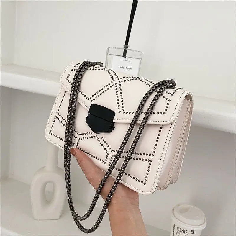 Fashionable PU leather crossbody bag with chain and rivet design